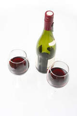 Bottle of red wine and two glasses