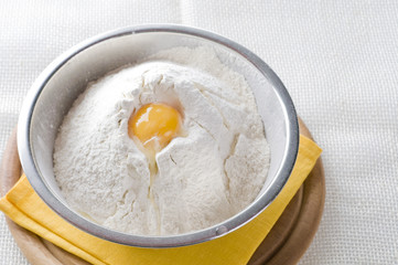 White flour and egg  in bowl