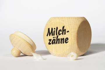 open box and two milk teeth