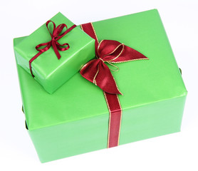 Gifts in green wrapping with bows on white background