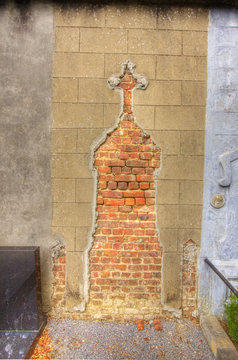 a tomb silhouette shape in brick