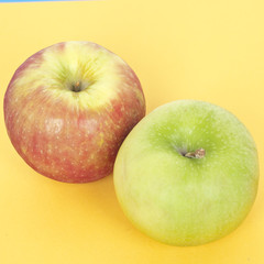 Pair of Apples on Vibrant Yellow