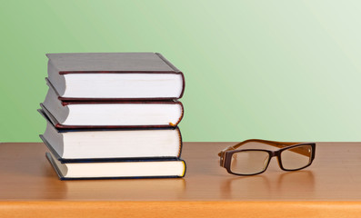 Eyeglasses and books book
