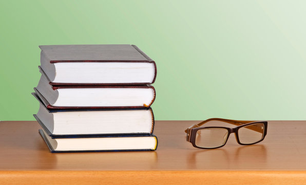 Eyeglasses and books book