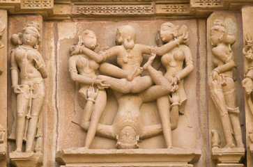 Erotic sculptures on  Hindu Temple at Khajuraho, India.