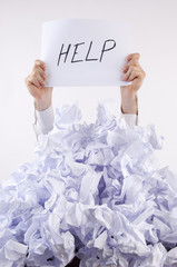 Businessman overwhelmed by the paper