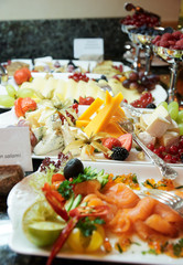Cheese, fish and fruits in expensive hotel