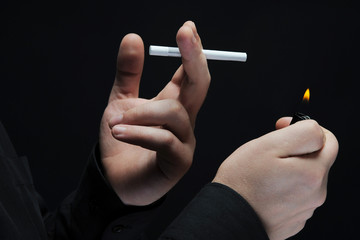 young man smokes a cigarette