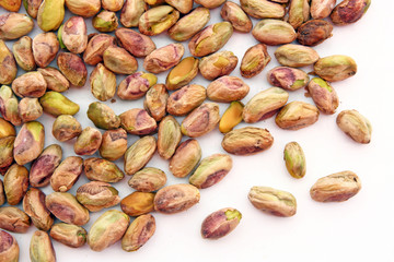heap of roasted Pistachio isolated on white