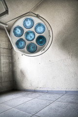 An abstract image of a surgical lamp at an abandoned hospital