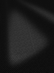 Woven black carbon fibre surface texture vertical