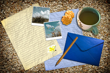 Letter with mail and tea on ground