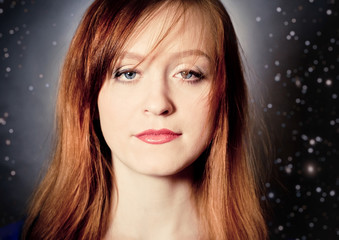 Red hair young woman in light