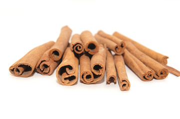 Cinnamon sticks on white