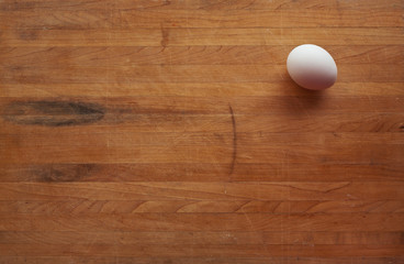 Single Egg on a Butcher Block Countertop