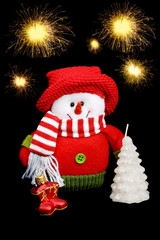 Snowman on the background of fireworks