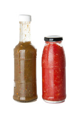 Bottles with homemade Caucasian sauce isolated on white