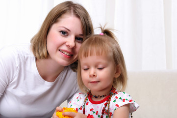 Young mother and her baby daughter