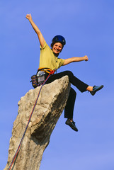 Female climber reaching the summit.