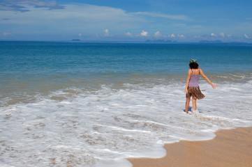 Fototapeta na wymiar Woman on the beautiful tropical beach