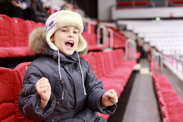 Boy loudly shouts on  hockey match