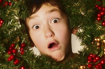 Boy In A Christmas Wreath