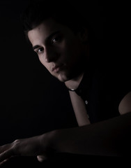 portrait of a young man in the darkness