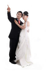 Happy Asian Young Couple on White Background &ndash; Studio Portrait

