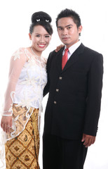 Happy Asian Young Couple on White Background &ndash; Studio Portrait

