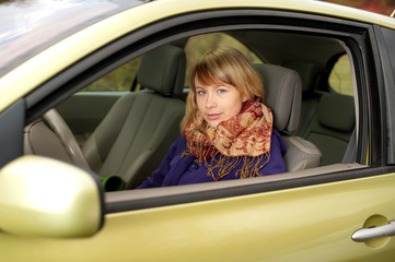 Cute teenage girl in a car