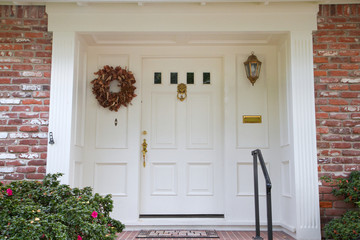 White door brick house