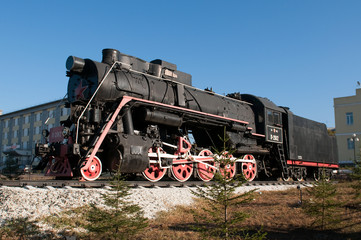 Fototapeta na wymiar Monument of old steam locomotive. Ulan-Ude, Russia