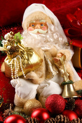 Close-up image of a toy Santa Claus in golden glasses