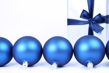 Blue matt christmas balls and gift-background with text space