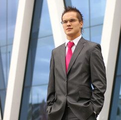 A young and handsome businessman in formal clothes