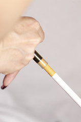 close up of cigarette in woman hand