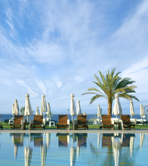 Fototapeta premium Image of a beautiful resort background with water and palms