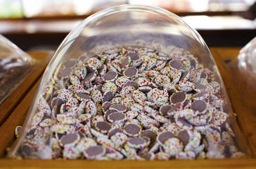 Chocolate candy buttons covered with sugar