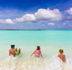 Children in tropical surf