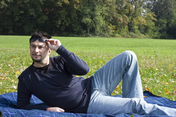 Young Adult Relaxing in the Park during a Weekend Afternoon