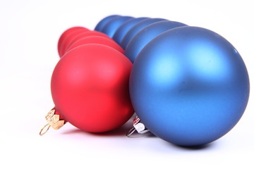 Blue and red matt christmas balls on white background