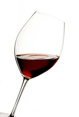 glass of red wine with a white background