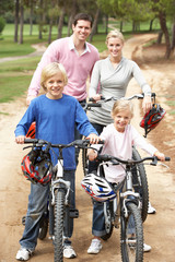 Naklejka premium Family enjoying bike ride in park