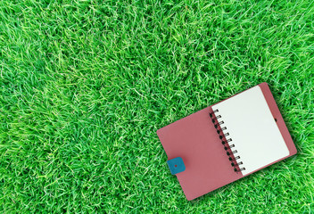 notebook on grass