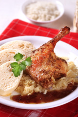 Roast duck with sauerkraut and dumplings