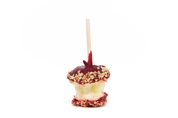 Partially Eaten Candy Apple Isolated against a White Background