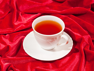 tea cup on the red velvet