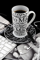 Coffee mug with fresh coffee on black background