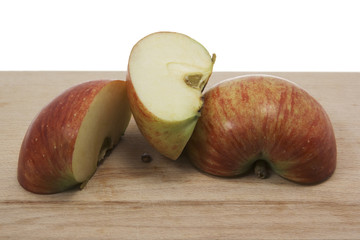 cut apple on wooden board.