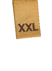 XXL size clothing label tag, isolated macro closeup